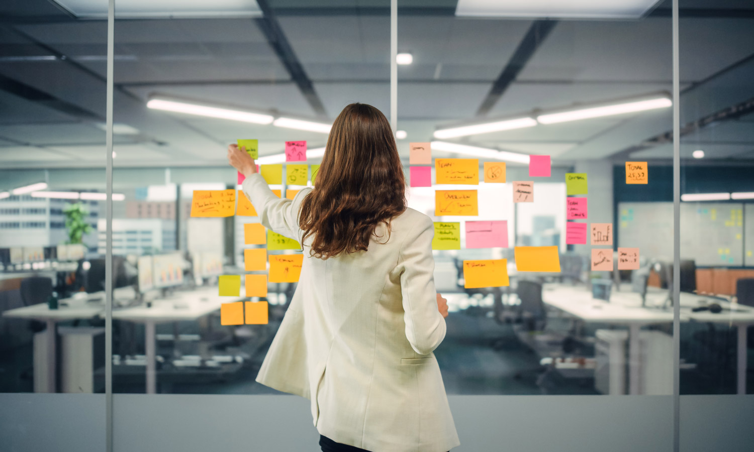 A marketing manager builds her annual strategic plan, including a mission, objectives, strategies, tactics, and key performance indicators (KPIs).